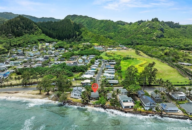 drone / aerial view featuring a water and mountain view