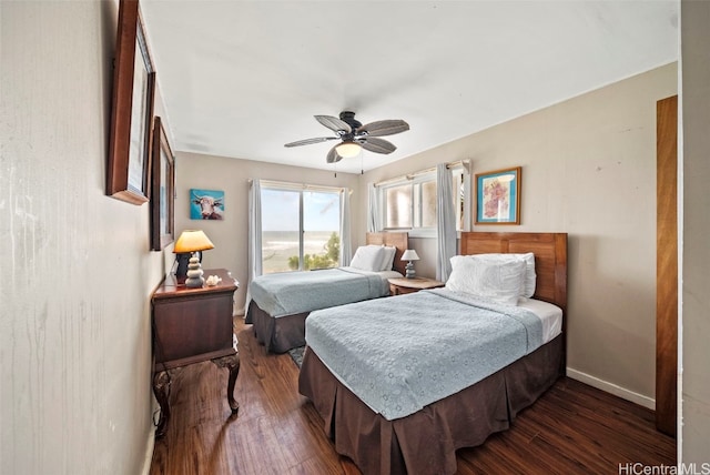 bedroom with ceiling fan and dark hardwood / wood-style flooring