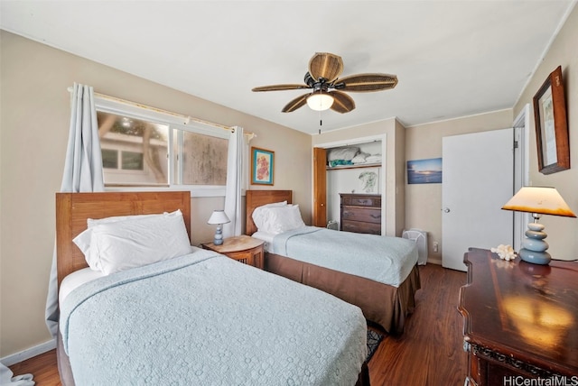 bedroom featuring ceiling fan and dark hardwood / wood-style floors