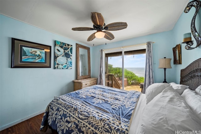 bedroom featuring ceiling fan, dark hardwood / wood-style floors, and access to exterior