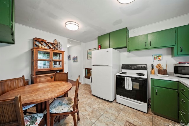 kitchen featuring green cabinets and white appliances