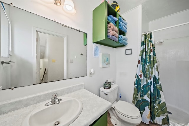 bathroom featuring vanity, toilet, and a shower with curtain