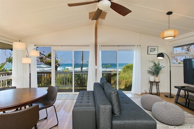 interior space with ceiling fan, light hardwood / wood-style floors, and lofted ceiling