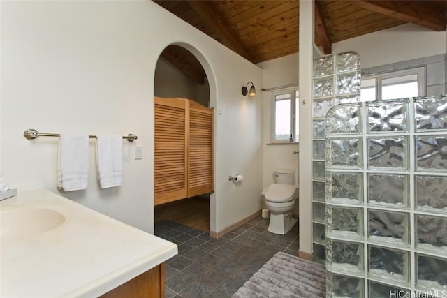 bathroom featuring vaulted ceiling with beams, plenty of natural light, and wooden ceiling