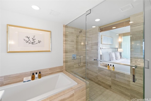 bathroom featuring separate shower and tub