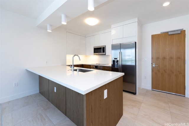 kitchen with white cabinetry, sink, light tile patterned floors, stainless steel appliances, and dark brown cabinets