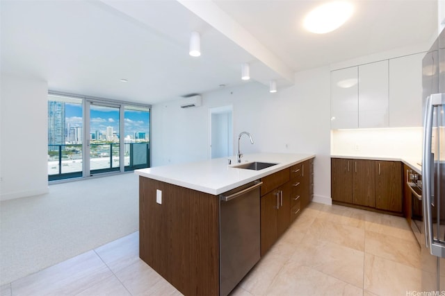 kitchen featuring a sink, dishwasher, an AC wall unit, a peninsula, and expansive windows