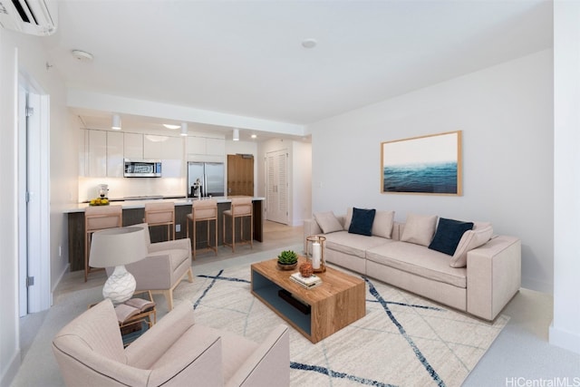 living room featuring light carpet and a wall unit AC