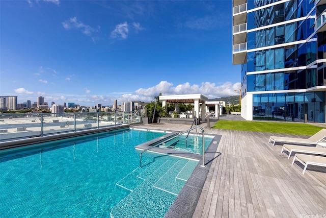 pool with a view of city and a community hot tub