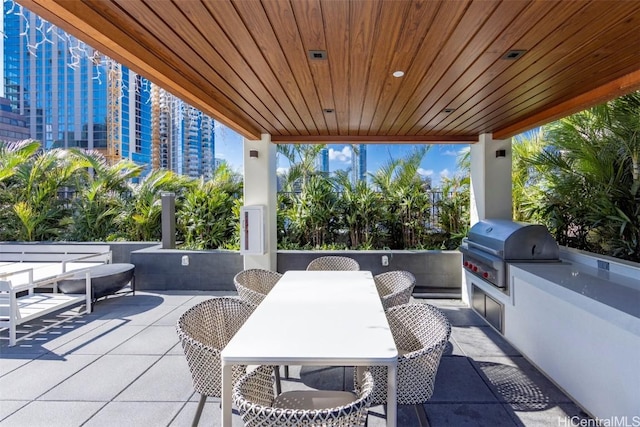 view of patio with area for grilling and grilling area