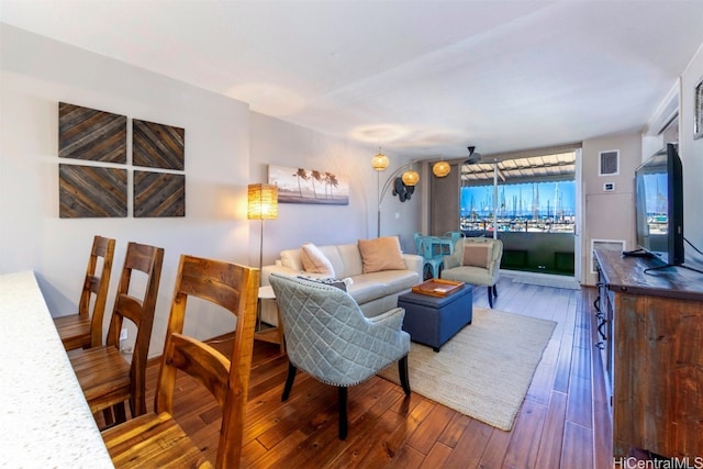 living room featuring dark wood-type flooring