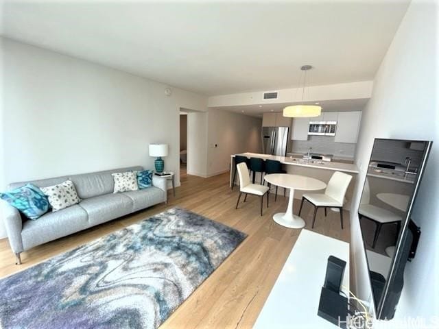 living room with light hardwood / wood-style floors