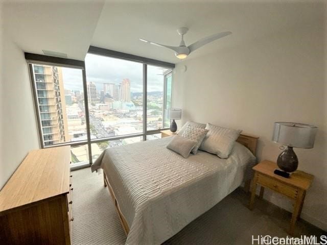 bedroom with ceiling fan and carpet floors