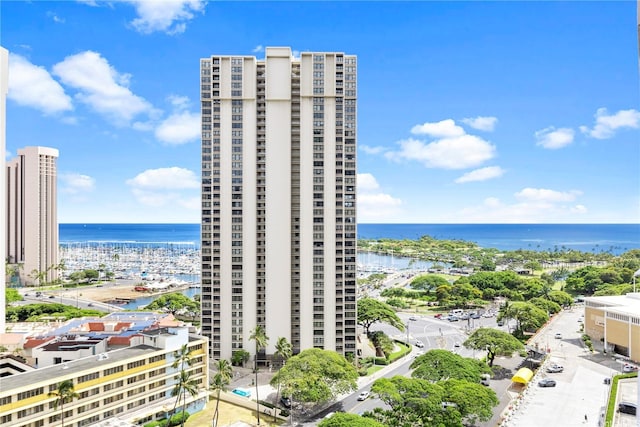 exterior space featuring a water view and a view of city
