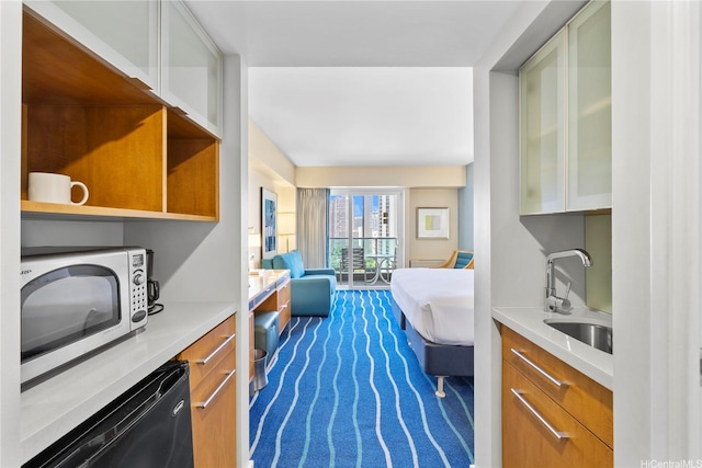 interior space featuring a sink and dark colored carpet