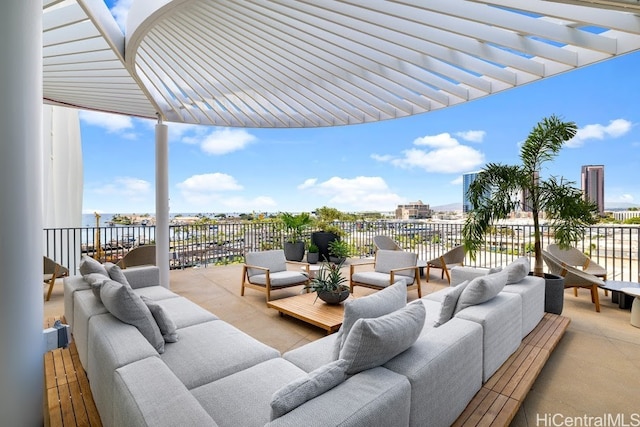 view of patio featuring a water view and outdoor lounge area