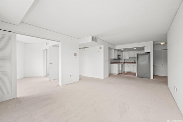 1314 Kalakaua Ave Unit 413, Honolulu, HI 96826 - unfurnished living room featuring light colored carpet