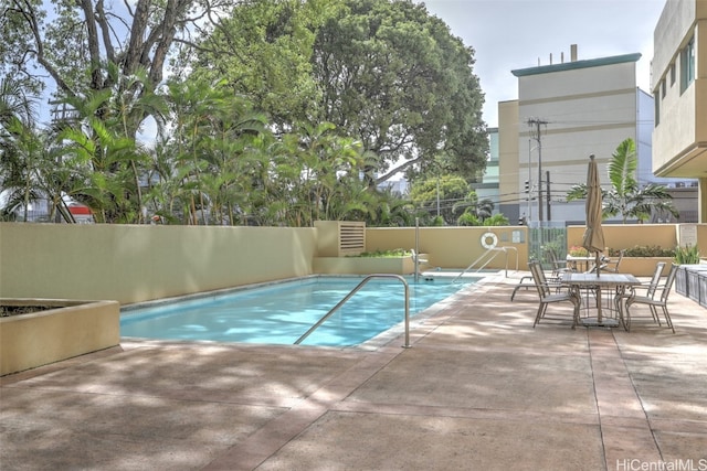 view of pool featuring a patio area