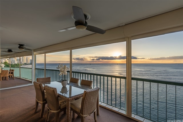 2877 Kalakaua Ave Unit 503/504, Honolulu, HI 96815 - sunroom / solarium featuring a water view and carpet flooring