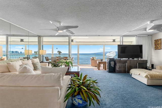 2877 Kalakaua Ave Unit 503/504, Honolulu, HI 96815 - carpeted living area featuring ceiling fan, a textured ceiling, and a wall of windows