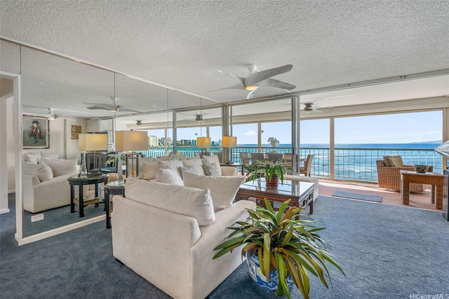 2877 Kalakaua Ave Unit 503/504, Honolulu, HI 96815 - living area with a ceiling fan, healthy amount of natural light, a textured ceiling, and dark colored carpet