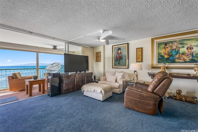 2877 Kalakaua Ave Unit 503/504, Honolulu, HI 96815 - living area with ceiling fan, carpet flooring, and a textured ceiling