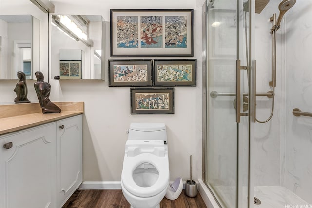 2877 Kalakaua Ave Unit 503/504, Honolulu, HI 96815 - bathroom with a marble finish shower, vanity, and wood finished floors