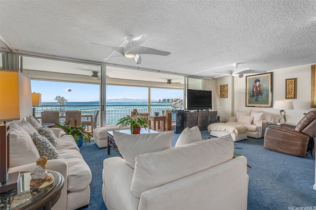 2877 Kalakaua Ave Unit 503/504, Honolulu, HI 96815 - carpeted living area with a ceiling fan, a textured ceiling, and floor to ceiling windows