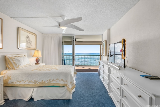 2877 Kalakaua Ave Unit 503/504, Honolulu, HI 96815 - bedroom with access to exterior, dark carpet, a ceiling fan, and a textured ceiling