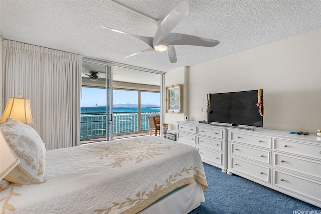 2877 Kalakaua Ave Unit 503/504, Honolulu, HI 96815 - bedroom featuring access to outside, dark colored carpet, a textured ceiling, and a ceiling fan
