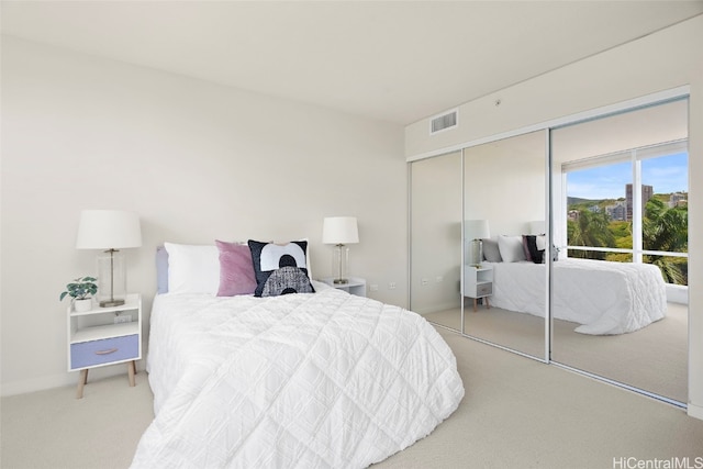 bedroom featuring a closet and carpet flooring