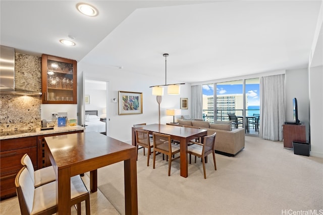 dining space with light carpet