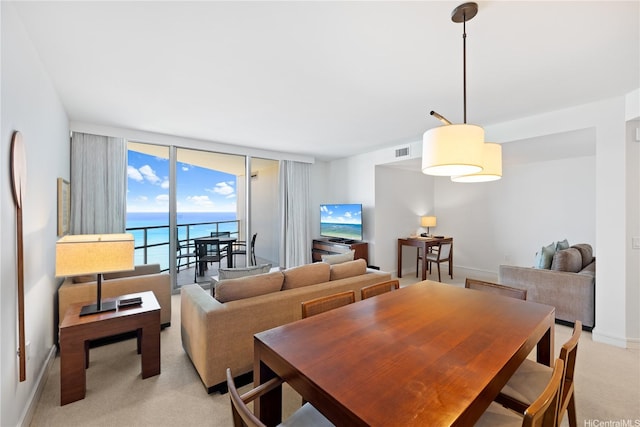 223 Saratoga Rd Unit 2708, Honolulu, HI 96815 - dining room featuring light colored carpet and floor to ceiling windows
