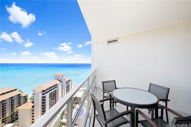 balcony featuring a water view