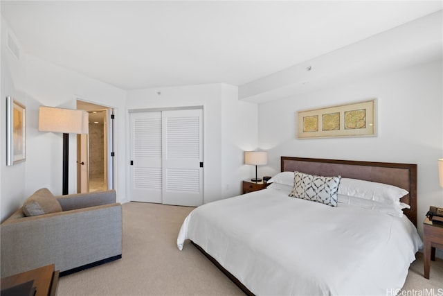 carpeted bedroom with a closet