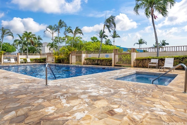 view of swimming pool with a patio area