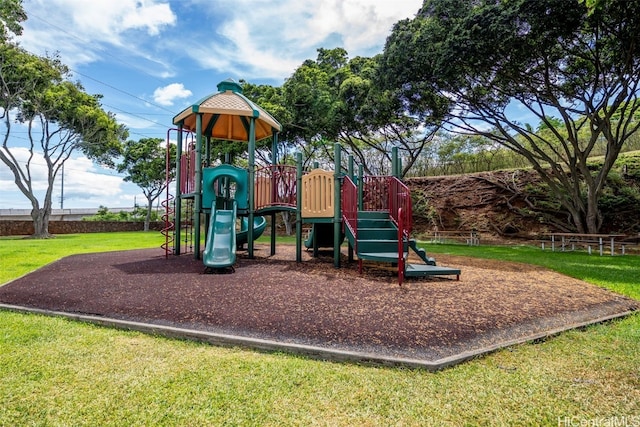 view of jungle gym with a lawn