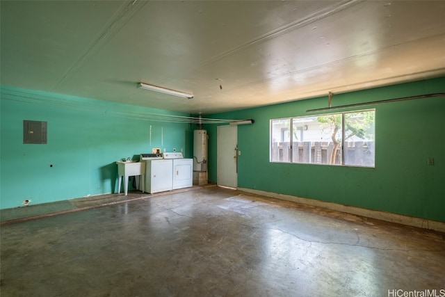 interior space with washing machine and clothes dryer and gas water heater