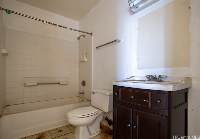 full bathroom with toilet, tiled shower / bath, vanity, and tile patterned flooring