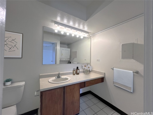 bathroom with vanity, toilet, and tile patterned floors