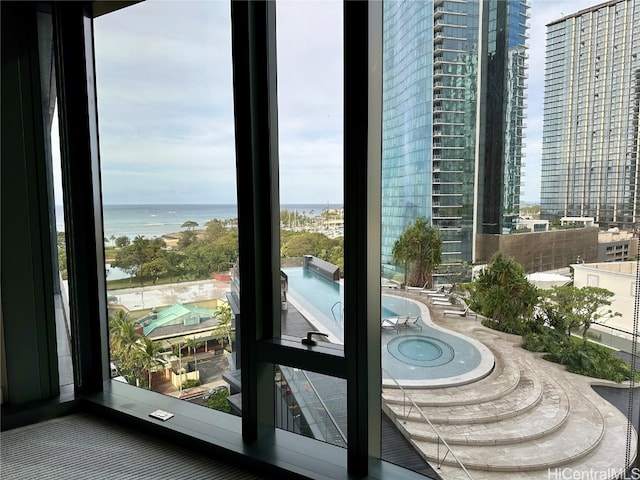 doorway to outside featuring a water view