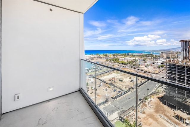 balcony featuring a water view