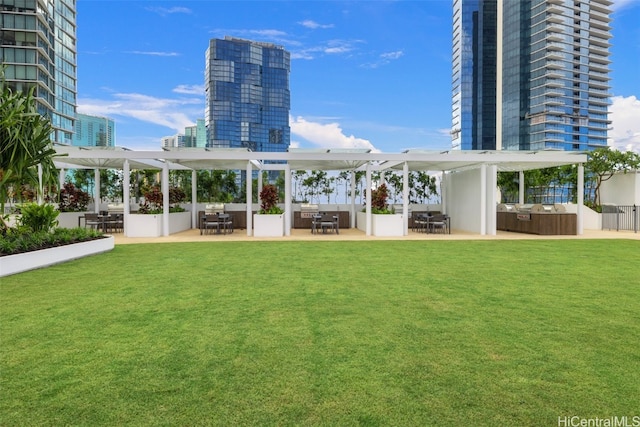 exterior space with a patio, an outdoor hangout area, a lawn, and a pergola