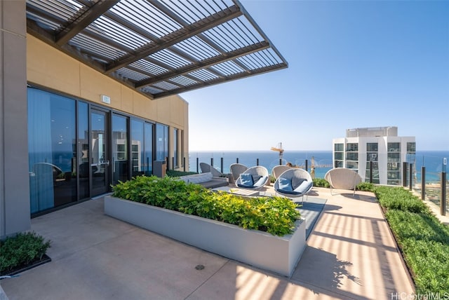 view of patio / terrace with a water view and a pergola