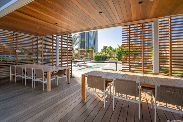 987 Queen St Unit 508, Honolulu, HI 96814 - wooden deck featuring outdoor dining area and a swimming pool
