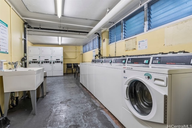 laundry room with sink and washer and clothes dryer
