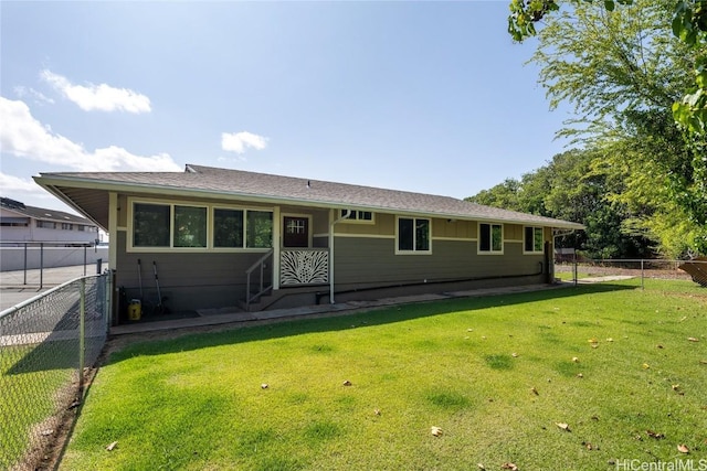 back of house featuring a yard