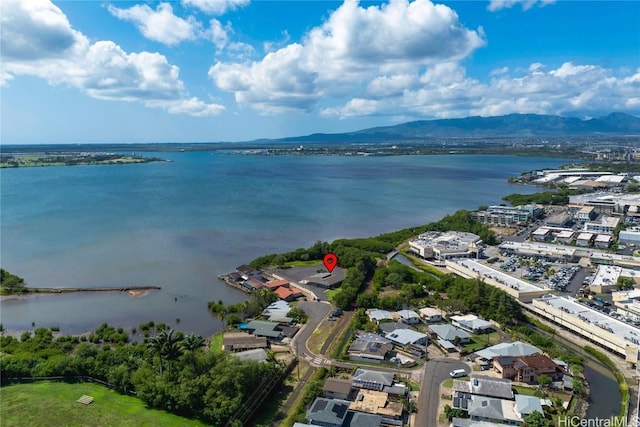 aerial view featuring a water and mountain view