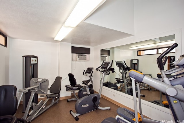 gym featuring a textured ceiling