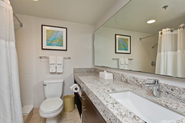 bathroom with toilet, curtained shower, vanity, and tile patterned flooring